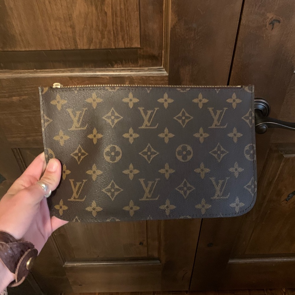 Louis Vuitton wristlet.